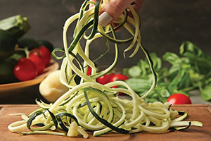 an assortment of vegetables on a cutting board