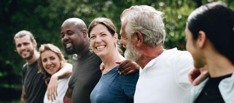 A line of people smiling