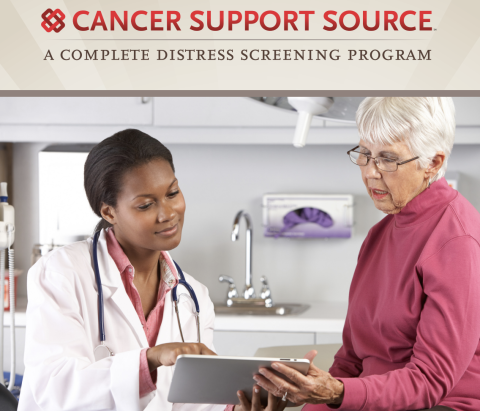 A female doctor discussing a clipboard with a female patient